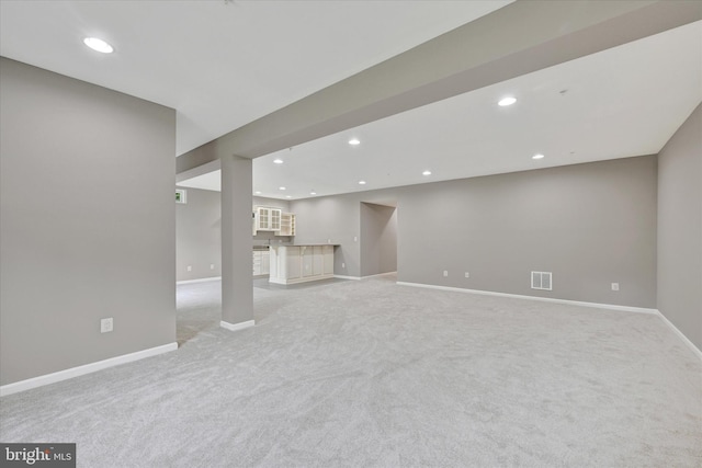 9830 Forge Valley Ct, Perry Hall, MD 21128 - unfurnished living room with light colored carpet, baseboards, recessed lighting, and bar area