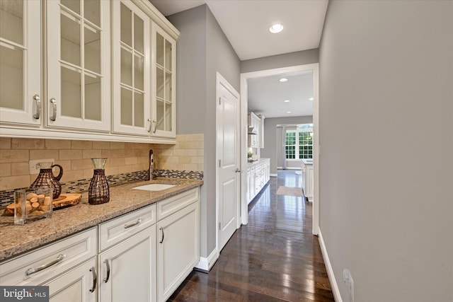 9830 Forge Valley Ct, Perry Hall, MD 21128 - bar area featuring a sink, tasteful backsplash, dark wood-type flooring, baseboards, and recessed lighting