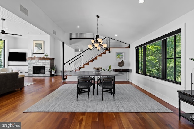 2514 Lyon Dr, Annapolis, MD 21403 - dining area featuring a chandelier, stairway, a stone fireplace, wood finished floors, and recessed lighting