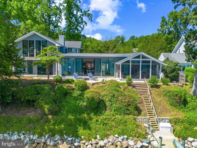 2514 Lyon Dr, Annapolis, MD 21403 - back of property featuring a sunroom, stairway, and a chimney