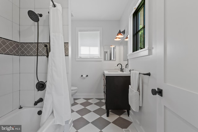 2514 Lyon Dr, Annapolis, MD 21403 - full bathroom featuring tile patterned floors, vanity, shower / bath combination with curtain, toilet, and baseboards