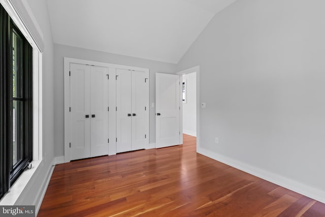 2514 Lyon Dr, Annapolis, MD 21403 - unfurnished bedroom featuring lofted ceiling, two closets, wood finished floors, and baseboards