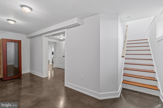 2514 Lyon Dr, Annapolis, MD 21403 - hallway with finished concrete floors, baseboards, and stairs