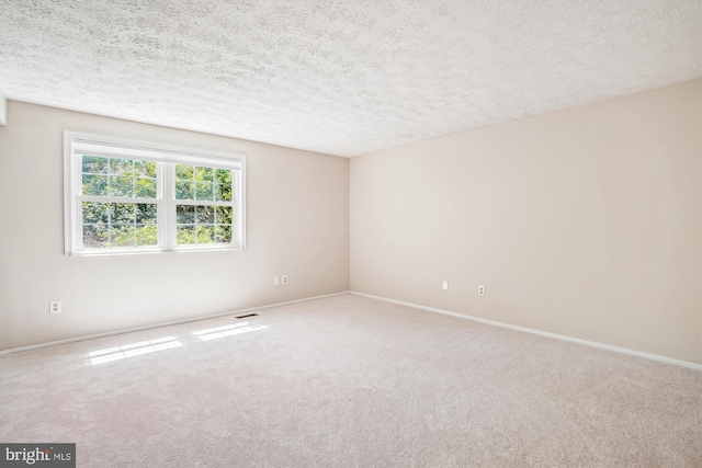 958 Tympani, Herndon, VA 20170 - spare room featuring carpet flooring, a textured ceiling, and baseboards