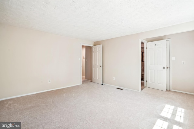 958 Tympani, Herndon, VA 20170 - empty room featuring light carpet, a textured ceiling, and baseboards