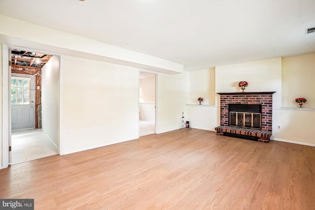 958 Tympani, Herndon, VA 20170 - unfurnished living room with wood finished floors and a brick fireplace