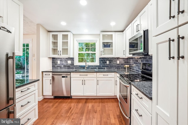 958 Tympani, Herndon, VA 20170 - kitchen with appliances with stainless steel finishes, a sink, light wood-style flooring, backsplash, and recessed lighting