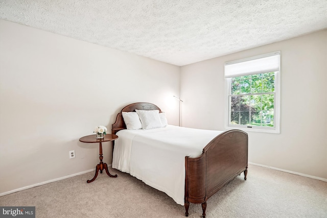 958 Tympani, Herndon, VA 20170 - bedroom featuring light colored carpet, baseboards, and a textured ceiling