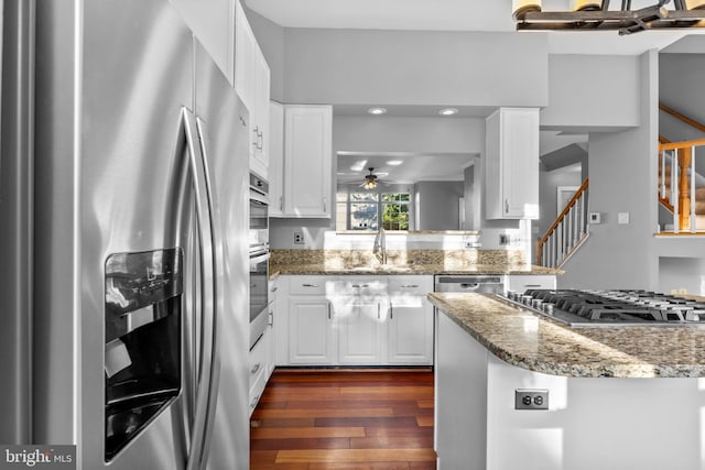 20580 Willoughby Sq, Sterling, VA 20165 - kitchen featuring appliances with stainless steel finishes, a ceiling fan, dark wood-style floors, white cabinets, and recessed lighting