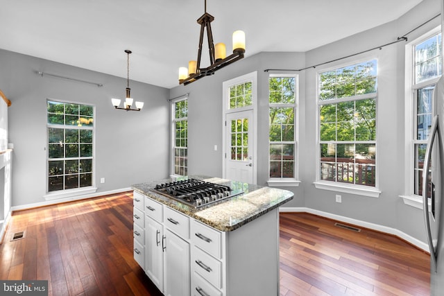 20580 Willoughby Sq, Sterling, VA 20165 - kitchen featuring a chandelier, stainless steel appliances, dark wood-style flooring, and light stone countertops