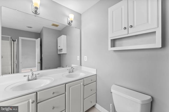 20580 Willoughby Sq, Sterling, VA 20165 - full bathroom featuring double vanity, toilet, and an enclosed shower