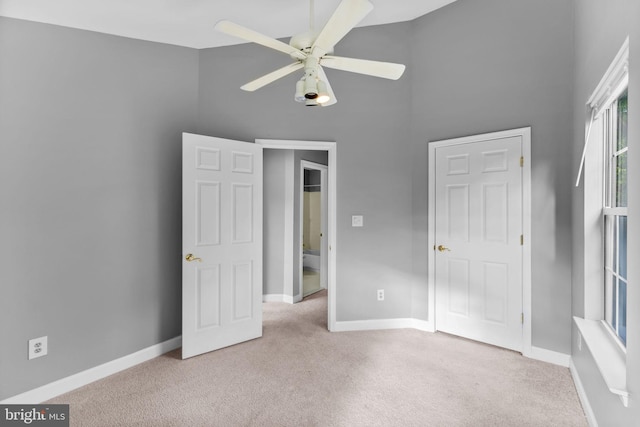 20580 Willoughby Sq, Sterling, VA 20165 - unfurnished bedroom featuring carpet flooring, a high ceiling, baseboards, and ceiling fan