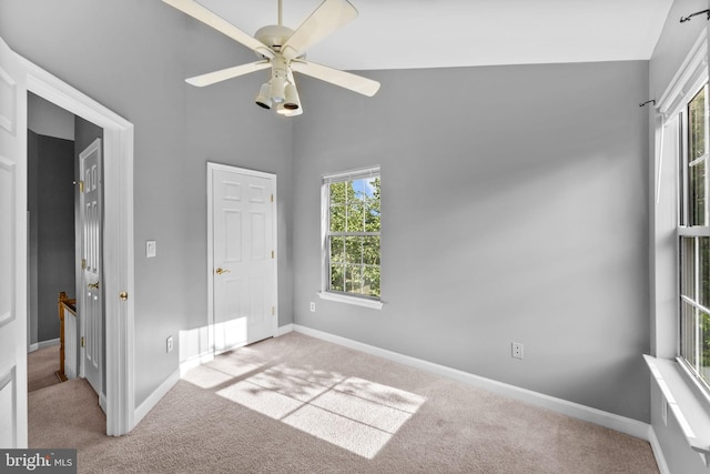 20580 Willoughby Sq, Sterling, VA 20165 - unfurnished bedroom with multiple windows, carpet flooring, baseboards, a towering ceiling, and a ceiling fan