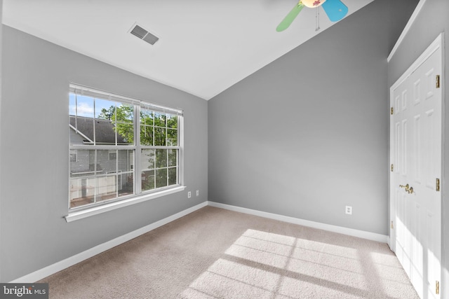 20580 Willoughby Sq, Sterling, VA 20165 - spare room with lofted ceiling, a ceiling fan, baseboards, and carpet