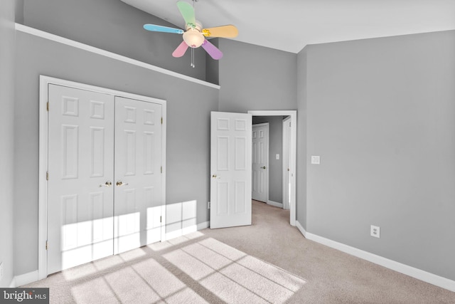 20580 Willoughby Sq, Sterling, VA 20165 - unfurnished bedroom featuring carpet floors, baseboards, a closet, ceiling fan, and a towering ceiling