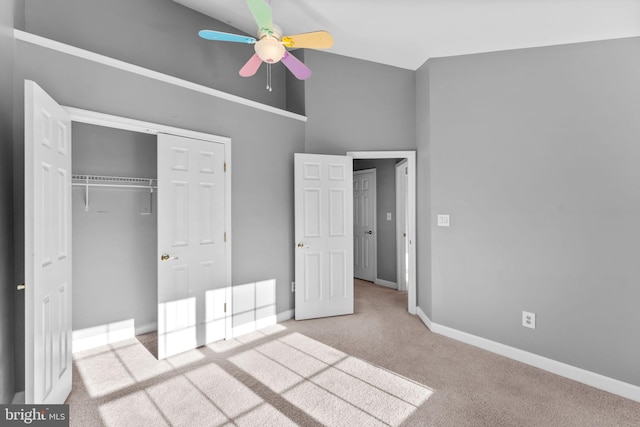 20580 Willoughby Sq, Sterling, VA 20165 - unfurnished bedroom with carpet flooring, a closet, baseboards, ceiling fan, and a high ceiling