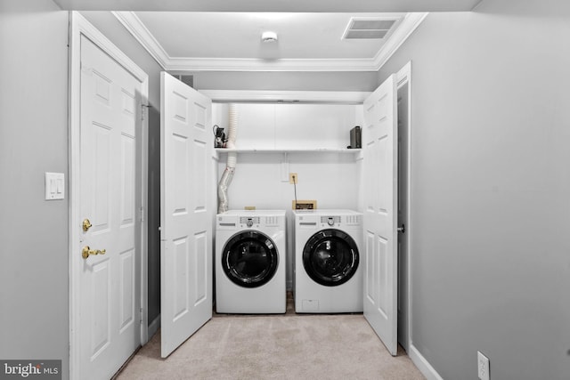 20580 Willoughby Sq, Sterling, VA 20165 - laundry room featuring independent washer and dryer, light carpet, and ornamental molding