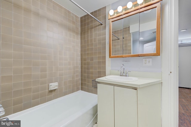 1726 U St NW Unit 1, Washington, DC 20009 - bathroom featuring  shower combination, vanity, and wood finished floors