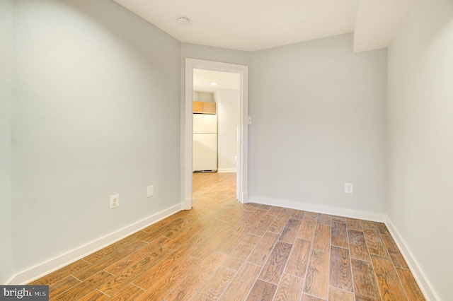 1726 U St NW Unit 1, Washington, DC 20009 - spare room featuring wood finished floors, baseboards, and a smoke detector