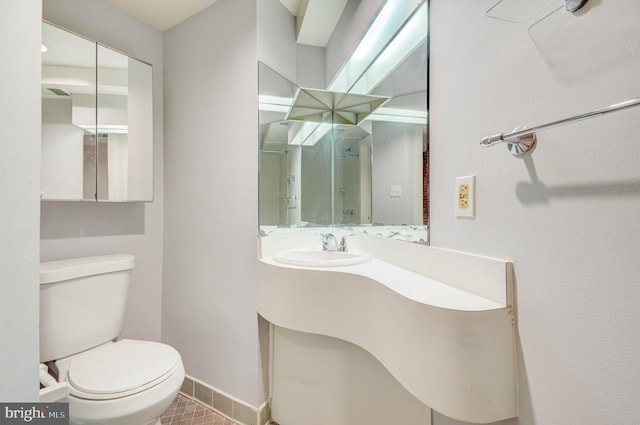 1726 U St NW Unit 1, Washington, DC 20009 - bathroom with toilet, baseboards, tile patterned floors, vanity, and a shower