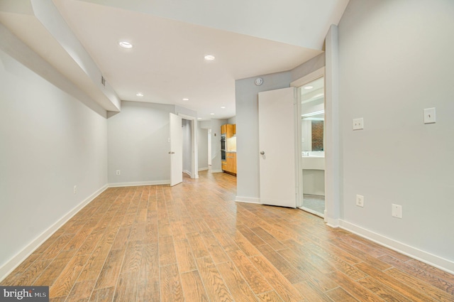 1726 U St NW Unit 1, Washington, DC 20009 - spare room featuring light wood finished floors, recessed lighting, and baseboards