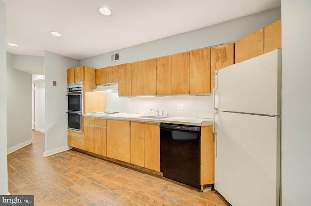 1726 U St NW Unit 1, Washington, DC 20009 - kitchen with white appliances, a sink, recessed lighting, light countertops, and light wood-style flooring