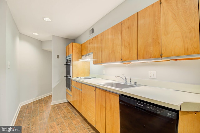 1726 U St NW Unit 1, Washington, DC 20009 - kitchen with a sink, dishwasher, exhaust hood, light countertops, and light wood-type flooring