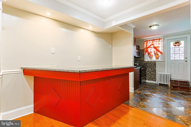 4719 Rorer St, Philadelphia, PA 19120 - indoor dry bar with radiator, crown molding, baseboards, and recessed lighting