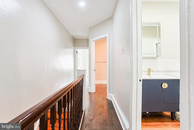 4719 Rorer St, Philadelphia, PA 19120 - corridor featuring hardwood / wood-style floors, a sink, and baseboards