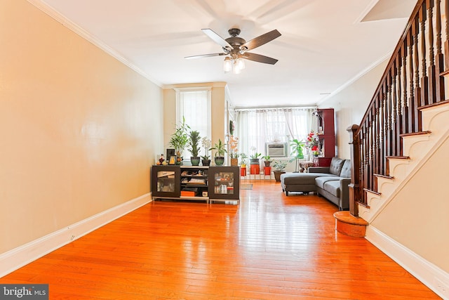 4719 Rorer St, Philadelphia, PA 19120 - living area featuring light wood-style flooring, ornamental molding, baseboards, ceiling fan, and stairs