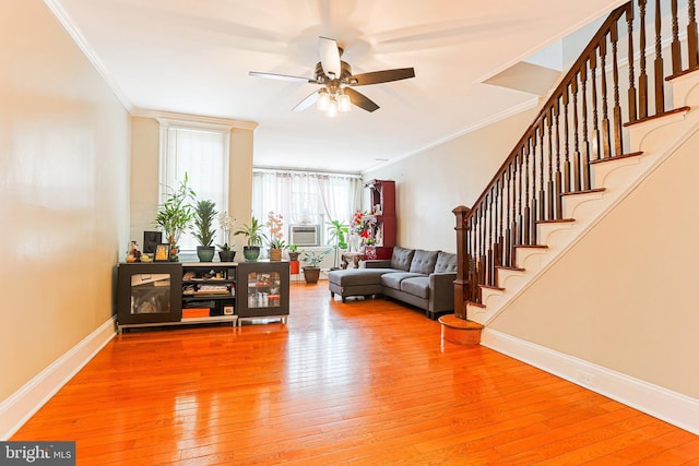4719 Rorer St, Philadelphia, PA 19120 - living room with ceiling fan, light wood finished floors, crown molding, and stairs