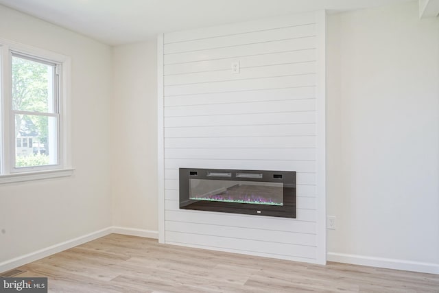 110 3rd St, Brooklawn, NJ 08030 - detailed view of wood finished floors, baseboards, and a large fireplace
