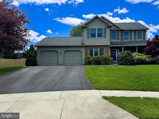 329 Hunter Path Rd, Hummelstown, PA 17036 - view of front facade featuring driveway, a garage, and brick siding