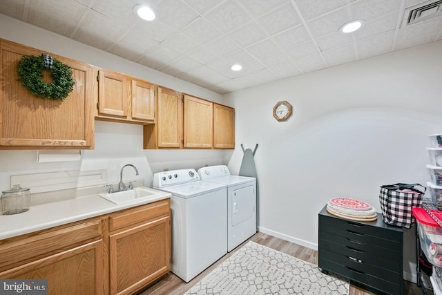 329 Hunter Path Rd, Hummelstown, PA 17036 - laundry area featuring washer and clothes dryer, cabinet space, light wood finished floors, and recessed lighting
