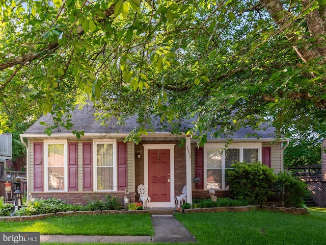 4333 Declaration Cir, Belcamp, MD 21017 - view of front of property with a front yard, a shingled roof, and brick siding