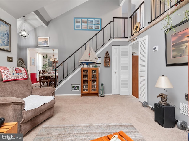 4333 Declaration Cir, Belcamp, MD 21017 - carpeted living room featuring high vaulted ceiling, stairway, baseboards, and a chandelier
