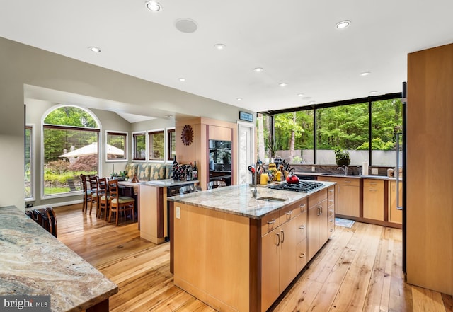 184 Pitman Downer Rd, Sewell, NJ 08080 - kitchen with a center island with sink, light stone countertops, light wood-type flooring, recessed lighting, and stainless steel gas cooktop