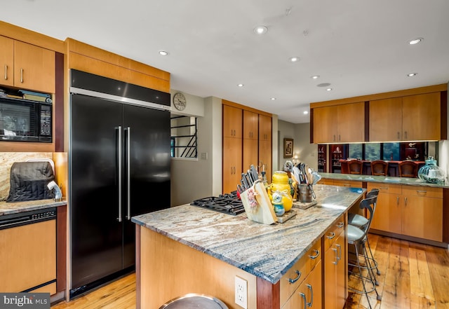 184 Pitman Downer Rd, Sewell, NJ 08080 - kitchen featuring built in refrigerator, black microwave, light wood-type flooring, gas stovetop, and recessed lighting