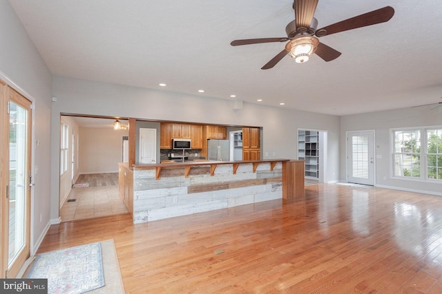 6081 Dotts Ln, Penn Laird, VA 22846 - unfurnished living room with light wood finished floors, a ceiling fan, baseboards, and recessed lighting