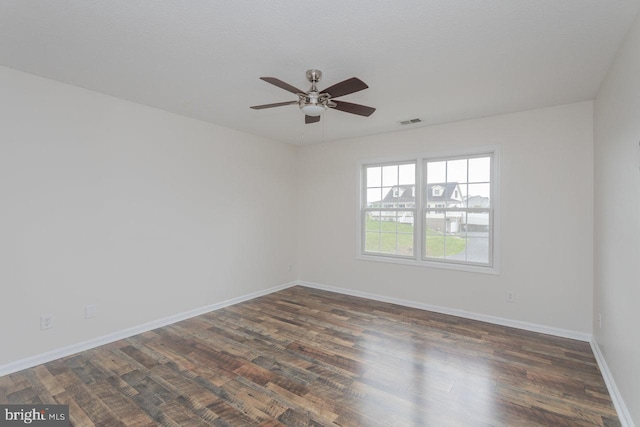 6081 Dotts Ln, Penn Laird, VA 22846 - unfurnished room featuring a ceiling fan, dark wood finished floors, and baseboards