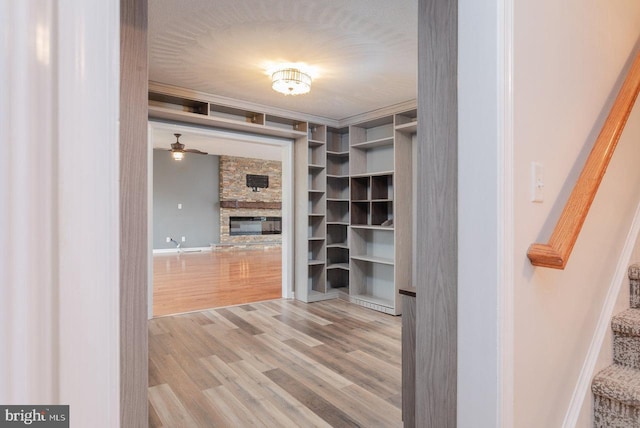 6081 Dotts Ln, Penn Laird, VA 22846 - spacious closet with a stone fireplace, wood finished floors, and ceiling fan