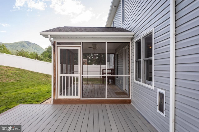 6081 Dotts Ln, Penn Laird, VA 22846 - wooden terrace with a sunroom, a mountain view, and a ceiling fan