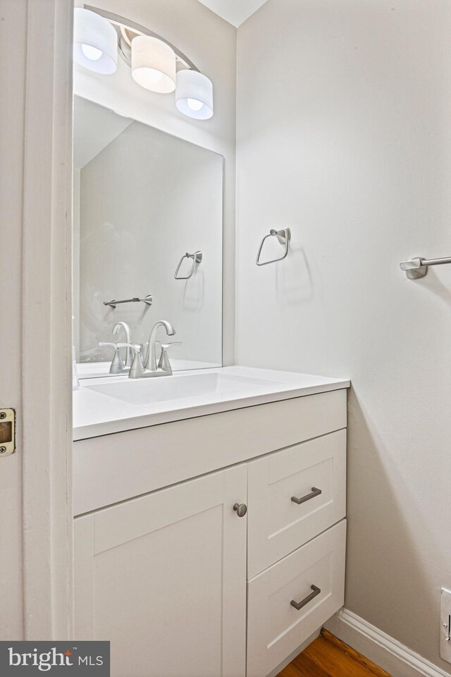 2249 Gunsmith Sq, Reston, VA 20191 - bathroom with vanity, wood finished floors, and baseboards