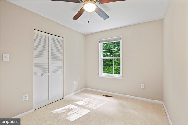 2249 Gunsmith Sq, Reston, VA 20191 - unfurnished bedroom featuring carpet flooring, baseboards, a closet, and ceiling fan