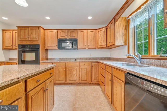 280 Center Rd, Lehighton, PA 18235 - kitchen with black appliances, a sink, light stone counters, recessed lighting, and light tile patterned floors