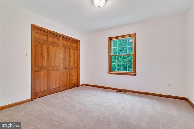280 Center Rd, Lehighton, PA 18235 - unfurnished bedroom featuring baseboards, light colored carpet, and a closet