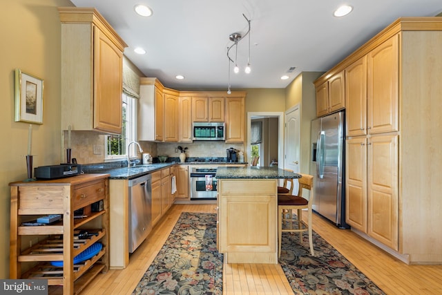1015 Riverview Ln, Conshohocken, PA 19428 - kitchen featuring appliances with stainless steel finishes, light wood finished floors, light brown cabinets, a kitchen island, and recessed lighting