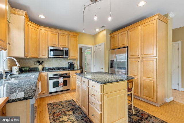 1015 Riverview Ln, Conshohocken, PA 19428 - kitchen featuring appliances with stainless steel finishes, a sink, light brown cabinets, light wood finished floors, and recessed lighting