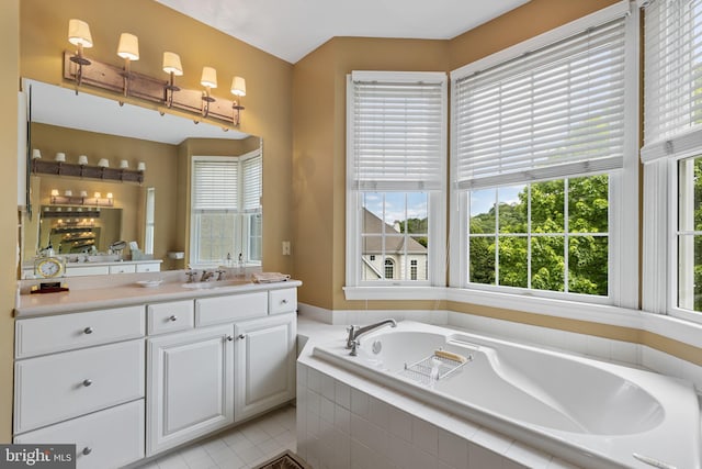 1015 Riverview Ln, Conshohocken, PA 19428 - bathroom featuring healthy amount of natural light, vanity, a garden tub, and tile patterned flooring