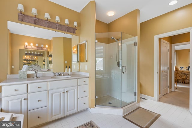 1015 Riverview Ln, Conshohocken, PA 19428 - ensuite bathroom featuring a stall shower, vanity, tile patterned floors, and baseboards
